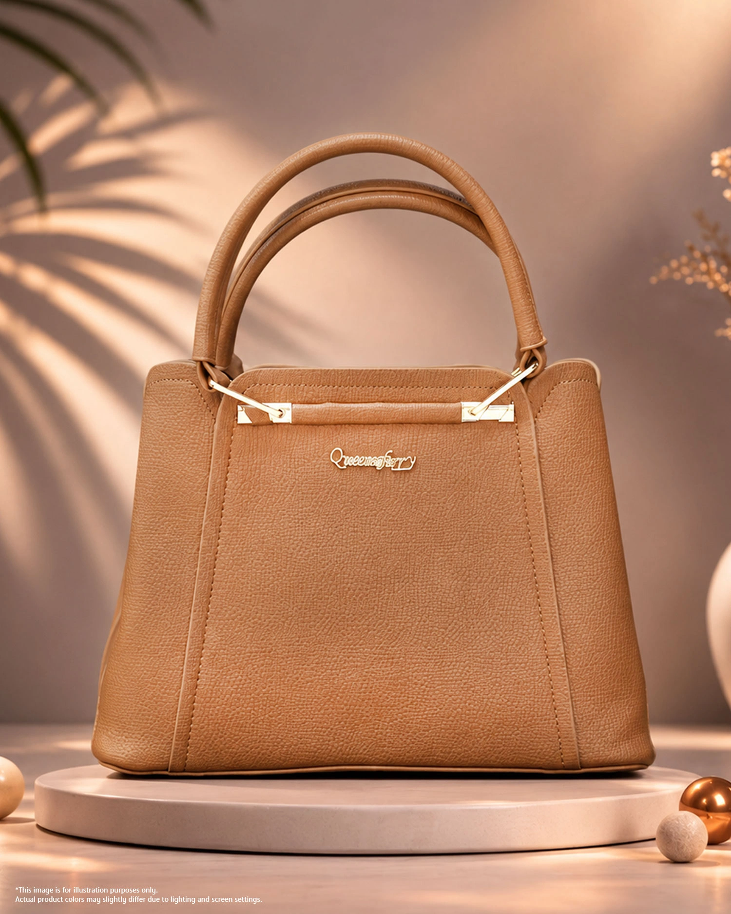 Tan Brown Structured Handbag Tan brown structured handbag with double handles and gold hardware.