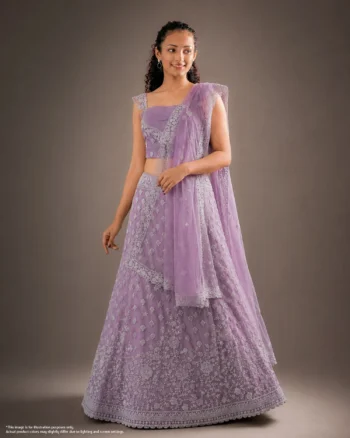 Elegant woman wearing a lavender lehenga with intricate silver floral embroidery