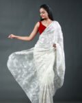 Off-white organza saree featuring intricate white floral thread embroidery and scalloped borders